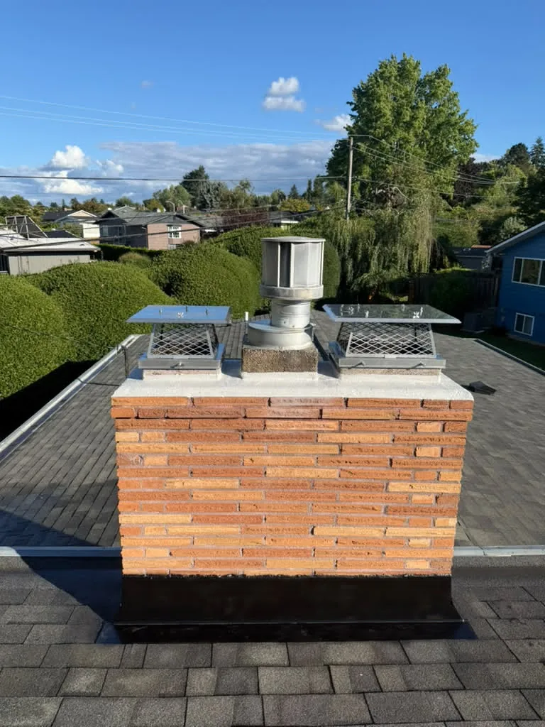 Spalled Brick & Cracked Crown → Repointed Masonry, New Crown, Caps & Flashing after