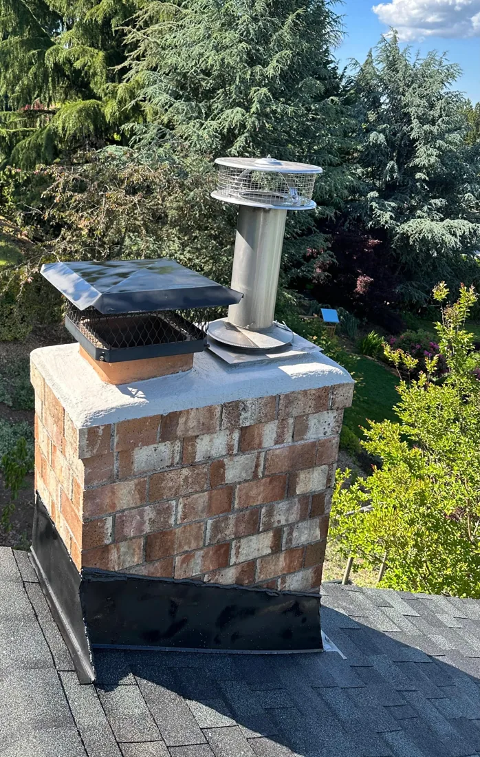 Failing Brick & Caps → Cleaned Masonry, New Crown & Base Flashing after
